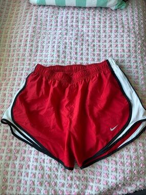 Nike Red Women's Athletic Running Shorts with White Side Panels and Black Trim